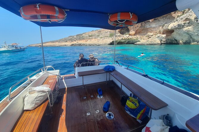 Boat Charters Blue lagoon, Crystal Lagoon, Comino, Malta 4hr trip - San Niklaw Bay: the last swim with a quieter feel