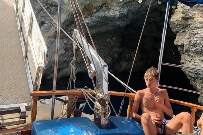 Comino, Blue Lagoon and Caves. Tour A - Onboard Comfort: Shade Decks, Showers, Toilets, and a Jump Platform