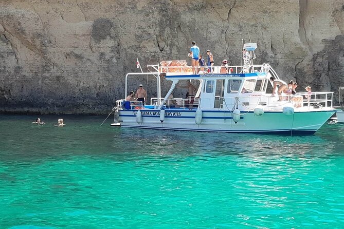 Comino Blue Lagoon and Gozo Private Boat Charter: Lucky Lady Boat - Crystal Lagoon and its caves: snorkeling masks and movie-set scenery