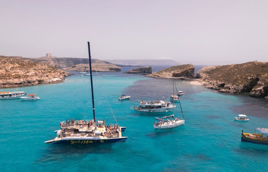 Comino: Blue Lagoon Catamaran Cruise with Lunch and Open Bar - Blue Lagoon swimming time, snorkel views, and the cave speedboat add-on