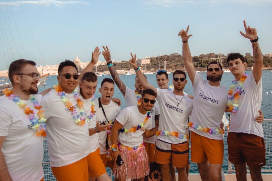 Comino: Blue Lagoon Catamaran Cruise with Lunch and Open Bar - Music and party energy on deck, with room to chill