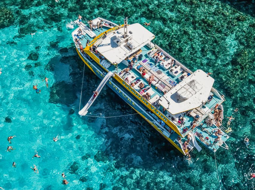 From Bugibba: Blue Lagoon Afternoon Swim with Sunset Cruise - Santa Maria Caves photo stop, then a calmer sea to watch the sun set