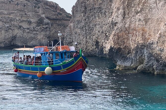 Full Day Private charter to Crystal & Blue Lagoon, Caves & Gozo - Crystal Lagoon caves, Saint Mary tower views, and that cave-to-sandy pocket moment