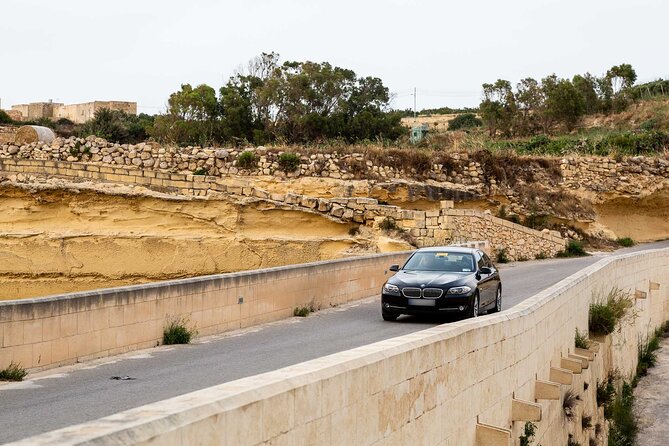 Gozo Highlights Tour in a comfortable private vehicle - Dwejra Bay: the former window site, the tower, and a weather-dependent boat trip