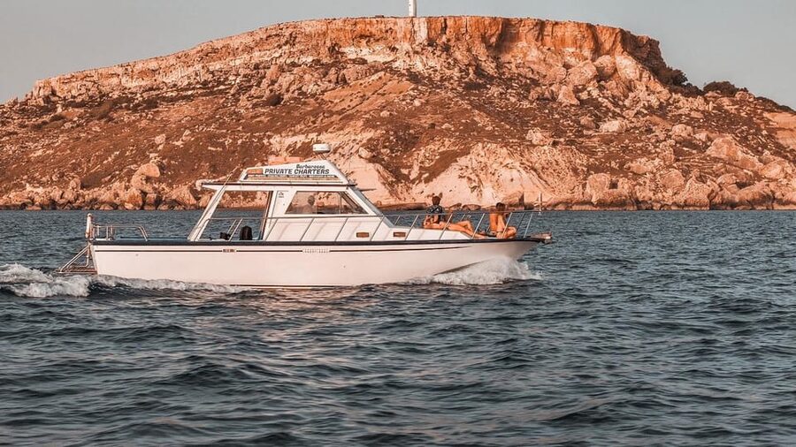 Malta: Blue Lagoon, Comino, Gozo & Crystal Lagoon Sea Caves - Crystal Lagoon: your 1-hour swim stop and the water slide fun
