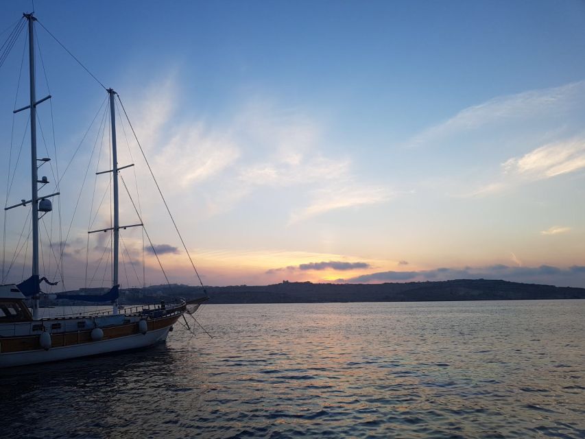 Malta: Blue Lagoon Evening Swim & Snorkel Boat Cruise - Getting on the Seahorse Cruises sailboat at Bugibba Jetty