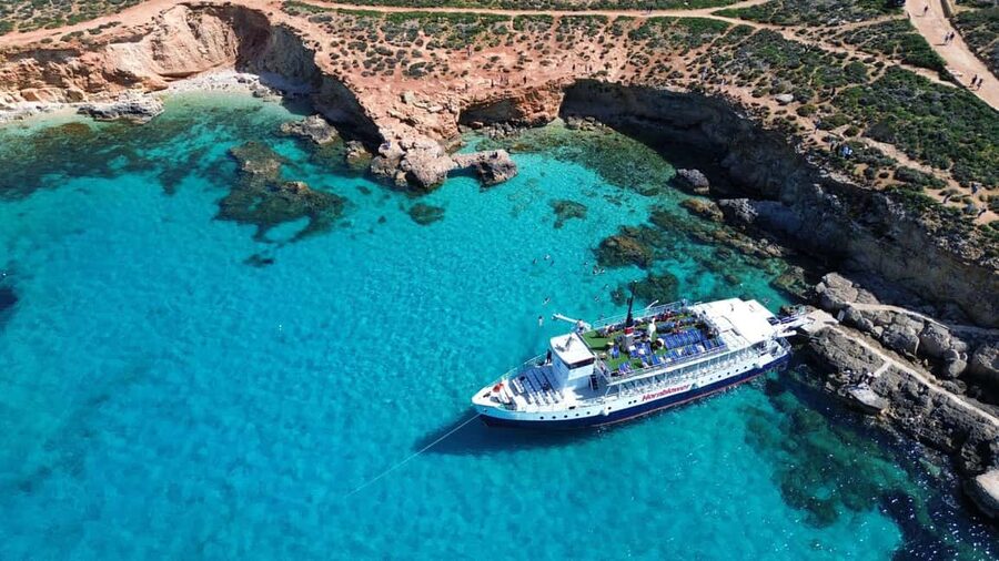 Malta: Gozo, Comino, Blue & Crystal Lagoon, & Caves Cruise - Blue Lagoon swim stop, snorkeling add-ons, and the 10-meter slide