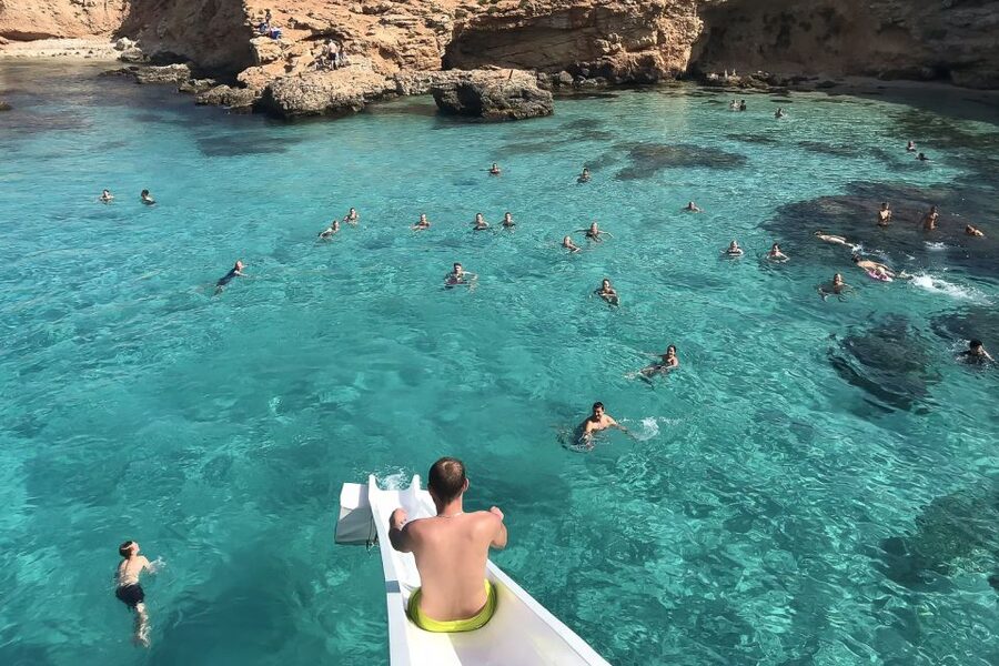 Malta: Gozo, Comino, Blue & Crystal Lagoon, & Caves Cruise - Comino time on the water: sun deck, slide moments, and staying put