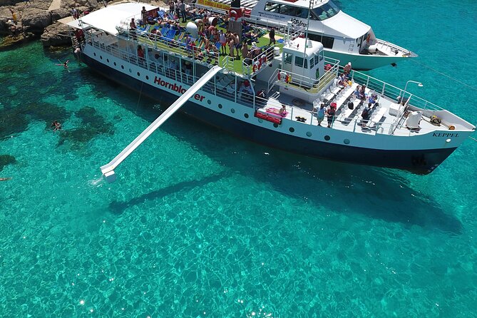 Malta Sunset Boat Tour: Bugibba to Comino Blue Lagoon Cruise - Food and drinks at a boat pace: easy snacks, not a formal meal