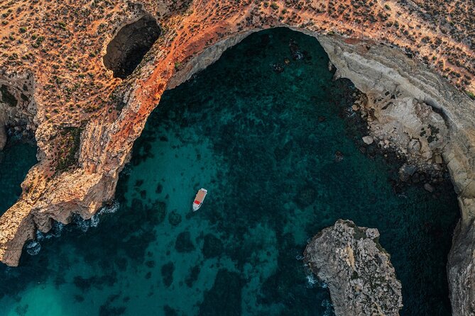 Mellieha: Gozo, Comino, Sea Caves, and Blue Lagoon Cruise - Santa Marija Bay and quick cave-and-rock photo moments