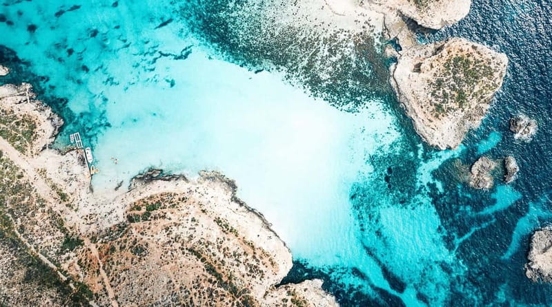 Mellieha: Round Comino, Blue Lagoon & Gozo Cruise with Water - Onboard Fun and Practical Comfort: Water Slide, Showers, and Deckchairs