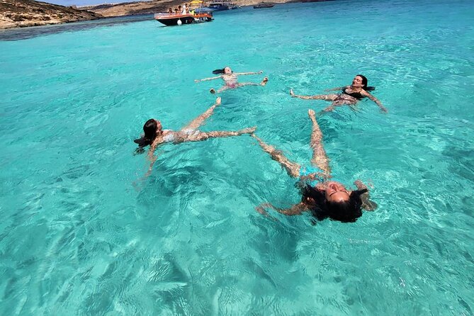 Private Boat Tour at Comino's Blue Lagoon and Crystal Lagoon - Crystal Lagoon: swimming, snorkeling, and cliff jumps with Comino Caves nearby